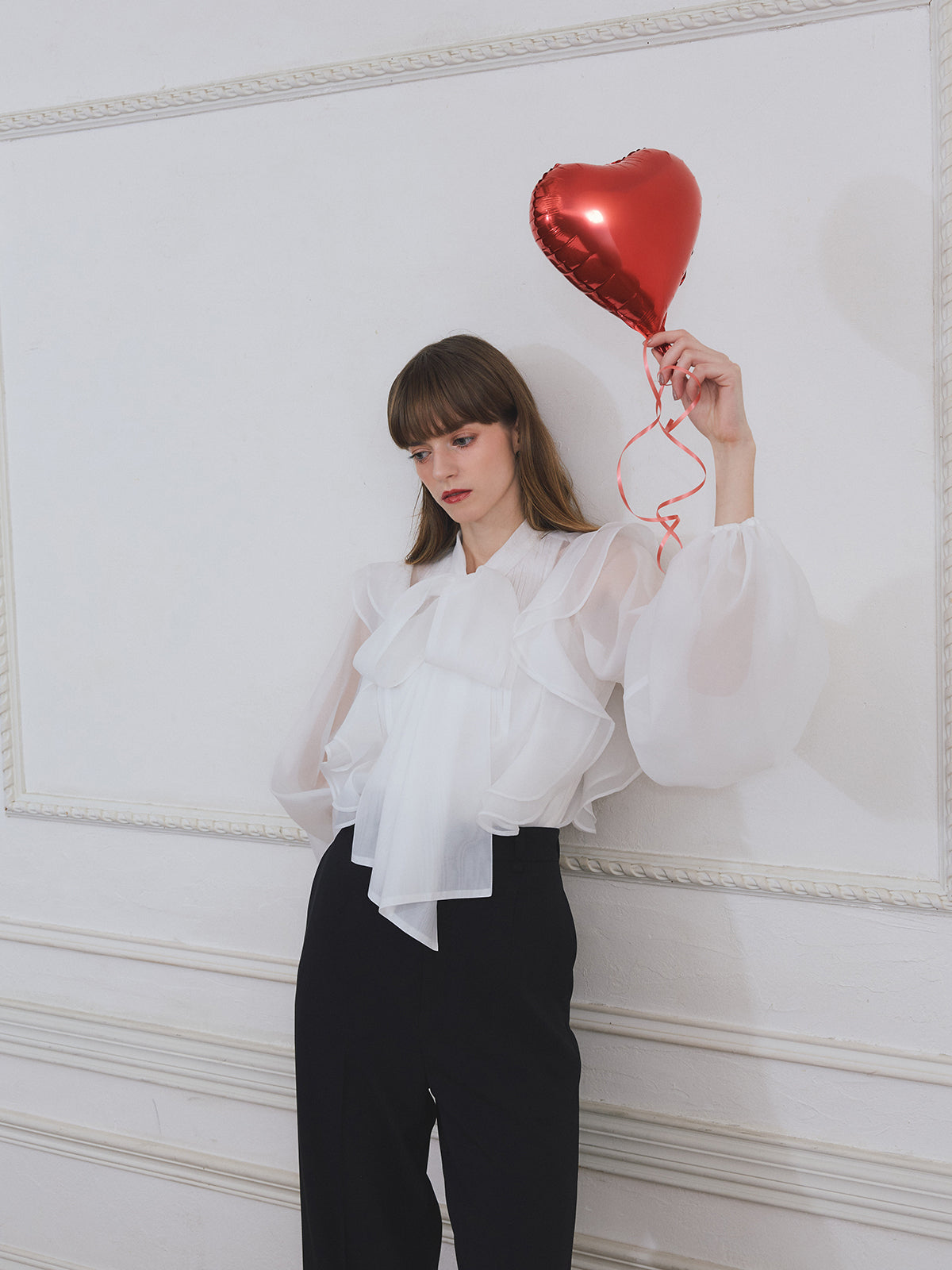 ボウタイラッフルブラウス